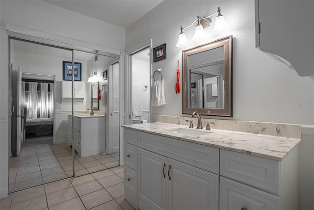 30 Turner St Unit 202, Clearwater, FL 33756 - bathroom with vanity, tile patterned flooring, and ensuite bath