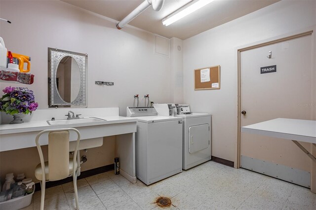 30 Turner St Unit 202, Clearwater, FL 33756 - washroom with a sink, washing machine and dryer, and light floors