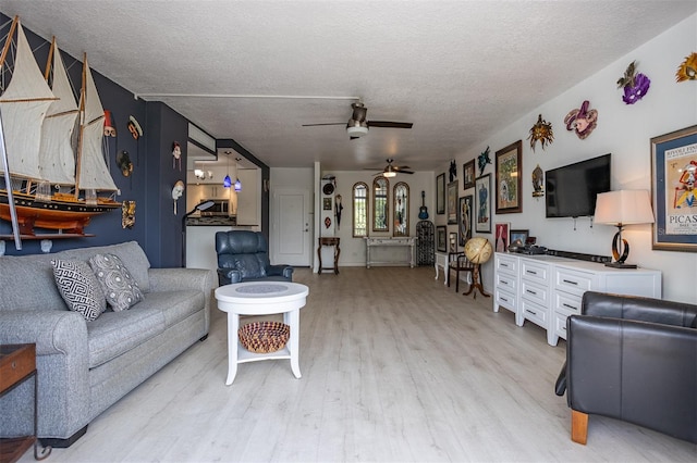 30 Turner St Unit 202, Clearwater, FL 33756 - living room with light wood-style flooring, a textured ceiling, and ceiling fan