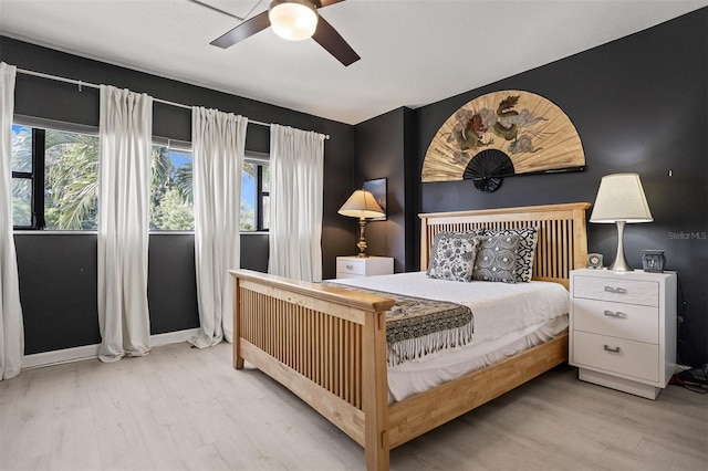 30 Turner St Unit 202, Clearwater, FL 33756 - bedroom featuring wood finished floors, ceiling fan, and baseboards
