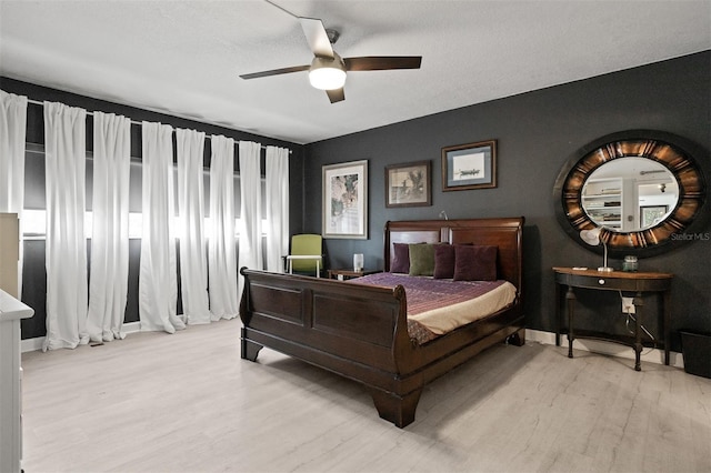 30 Turner St Unit 202, Clearwater, FL 33756 - bedroom featuring light wood-type flooring and a ceiling fan