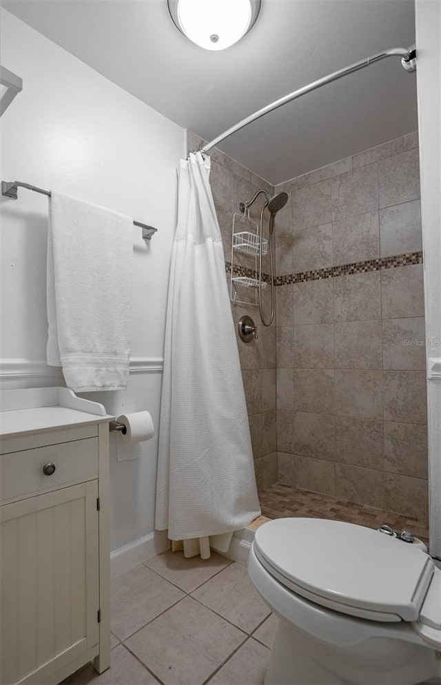 30 Turner St Unit 202, Clearwater, FL 33756 - bathroom featuring tile patterned flooring, a shower stall, and toilet