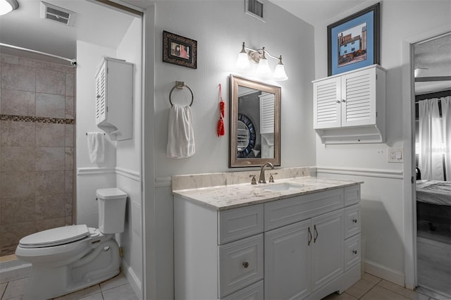30 Turner St Unit 202, Clearwater, FL 33756 - full bath with tile patterned flooring, toilet, vanity, ensuite bathroom, and a tile shower