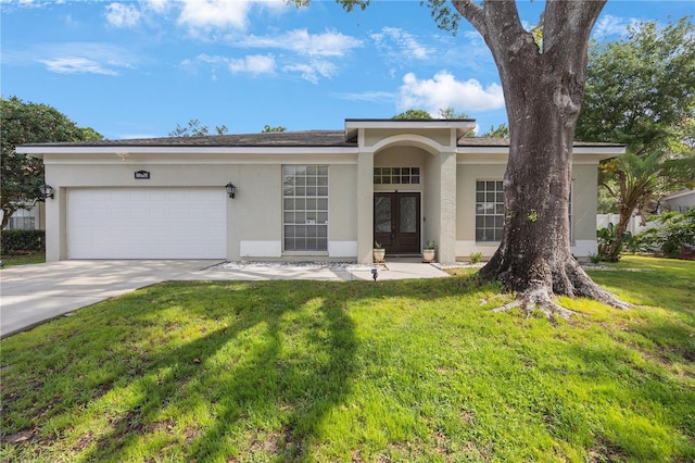18520 Ambly Ln, Tampa, FL 33647 - ranch-style house with french doors, stucco siding, an attached garage, and concrete driveway