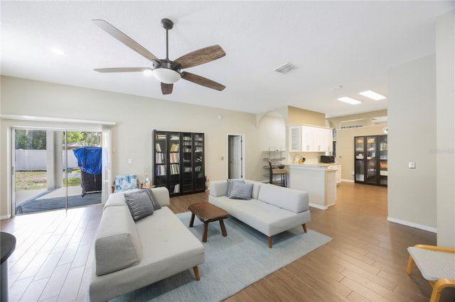 18520 Ambly Ln, Tampa, FL 33647 - living room featuring wood finished floors, a ceiling fan, and baseboards