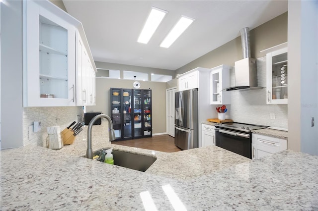 18520 Ambly Ln, Tampa, FL 33647 - kitchen with appliances with stainless steel finishes, a sink, backsplash, white cabinets, and light stone countertops