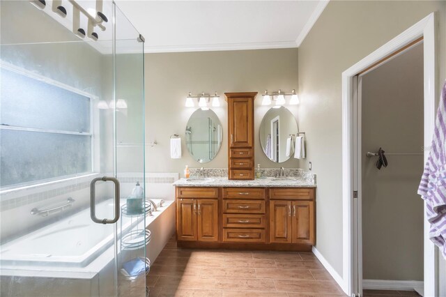 18520 Ambly Ln, Tampa, FL 33647 - full bath featuring crown molding, a bath, double vanity, a stall shower, and wood finished floors