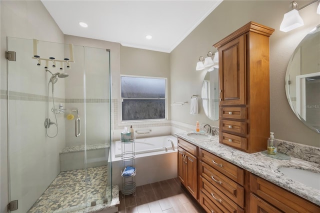 18520 Ambly Ln, Tampa, FL 33647 - bathroom with a stall shower, a garden tub, double vanity, wood finished floors, and crown molding
