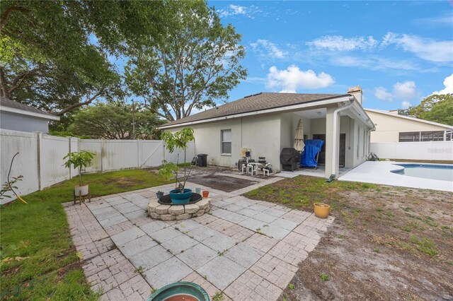 18520 Ambly Ln, Tampa, FL 33647 - back of property with a patio, a fenced backyard, and stucco siding