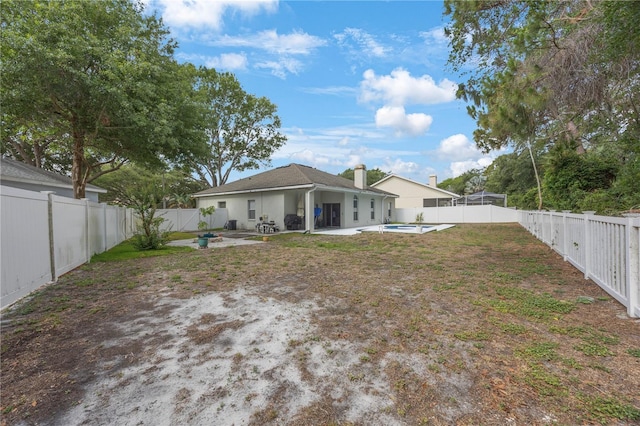 18520 Ambly Ln, Tampa, FL 33647 - fenced backyard with a patio area