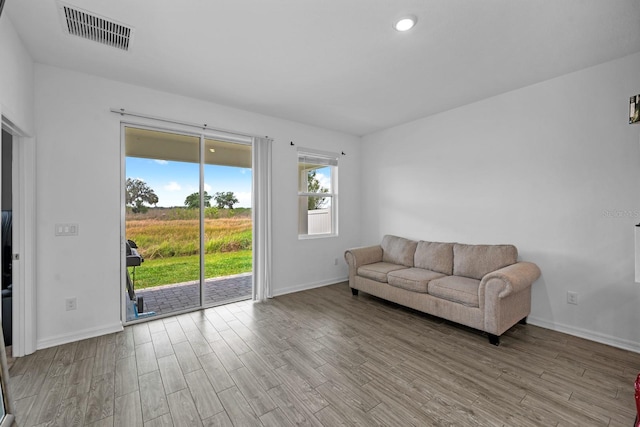 11819 Brighton Knoll Loop, Riverview, FL 33579 - living room featuring wood finished floors, baseboards, and recessed lighting