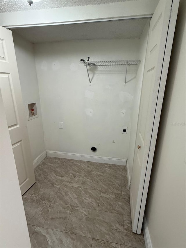 washroom with baseboards, laundry area, electric dryer hookup, and hookup for a washing machine