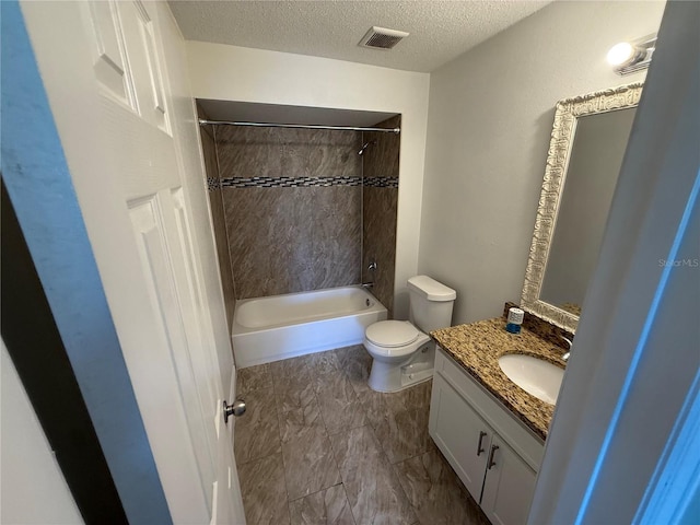 bathroom with visible vents, vanity, toilet, a textured ceiling, and shower / bath combination