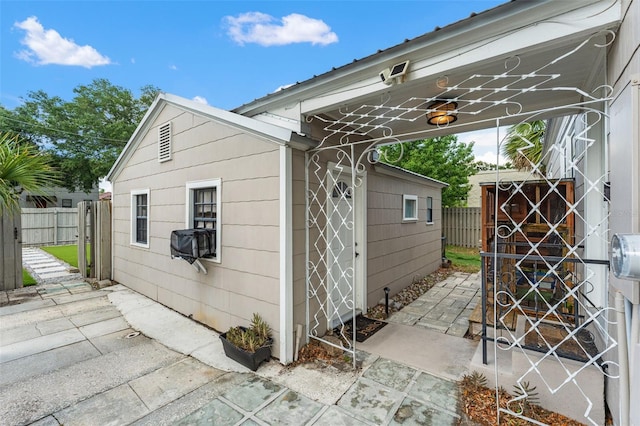 view of outdoor structure featuring fence
