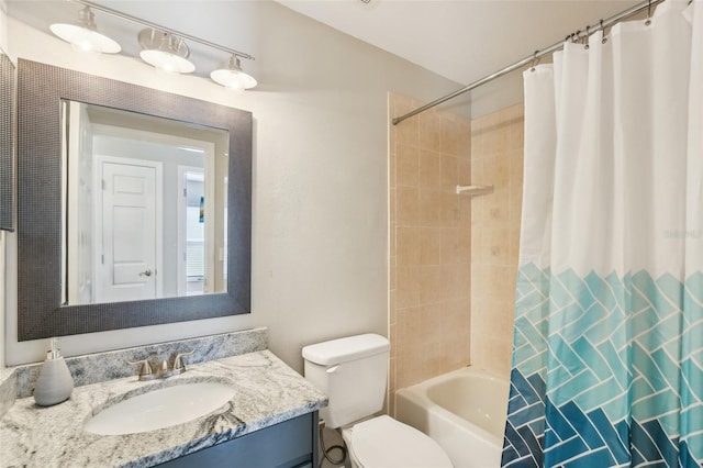 full bath with vanity, toilet, and shower / tub combo