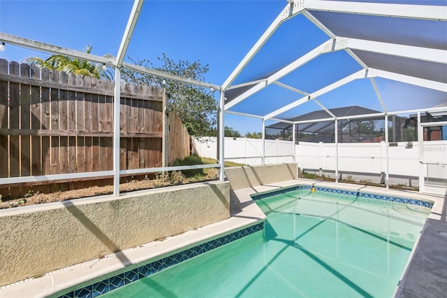 view of pool featuring a fenced in pool, a fenced backyard, and a lanai