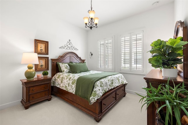 bedroom with a notable chandelier, baseboards, and light colored carpet