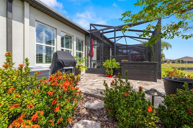 view of patio featuring a lanai and grilling area