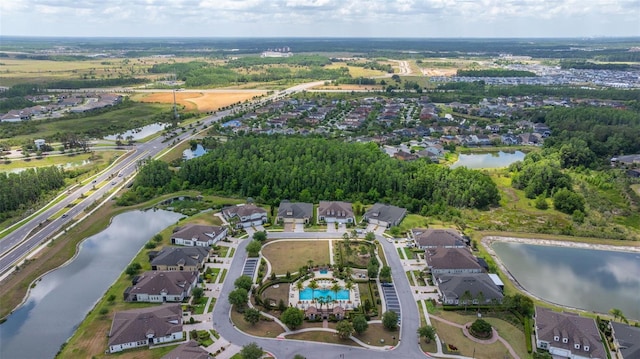 bird's eye view featuring a water view and a residential view