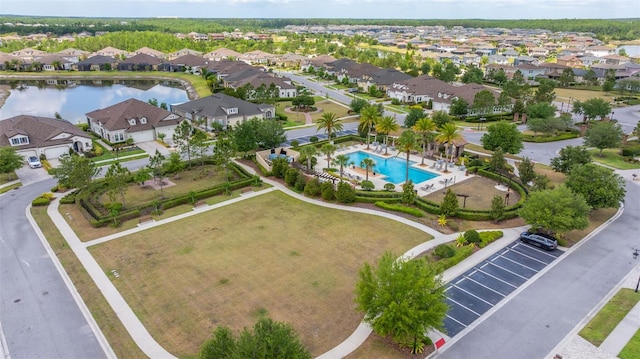 aerial view featuring a residential view and a water view