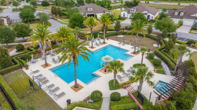 pool featuring a patio and fence