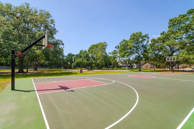 view of basketball court with a yard and community basketball court