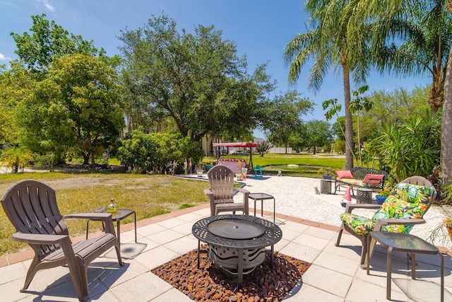 view of patio / terrace featuring an outdoor fire pit