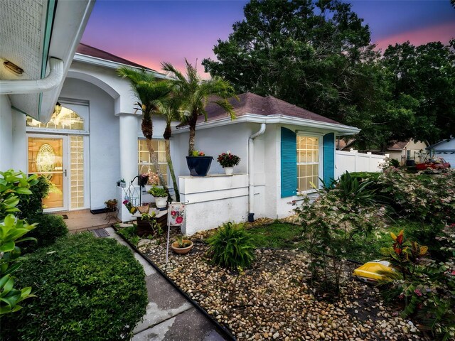 1424 Ridge Shore Dr, Tarpon Springs, FL 34689 - view of front of house with stucco siding