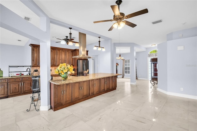 1424 Ridge Shore Dr, Tarpon Springs, FL 34689 - kitchen featuring freestanding refrigerator, a ceiling fan, a chandelier, and backsplash