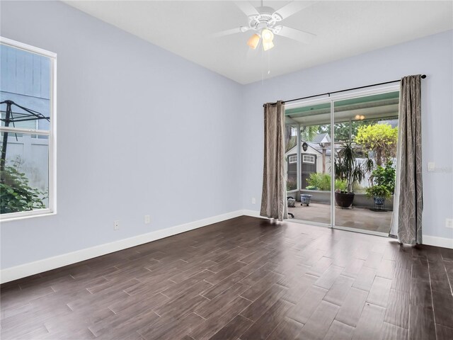 1424 Ridge Shore Dr, Tarpon Springs, FL 34689 - spare room with dark wood finished floors and ceiling fan