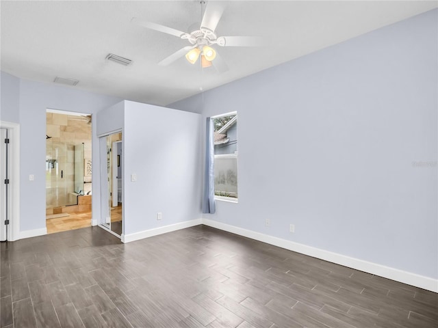 1424 Ridge Shore Dr, Tarpon Springs, FL 34689 - unfurnished bedroom with dark wood-type flooring and ceiling fan