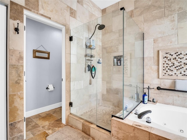 1424 Ridge Shore Dr, Tarpon Springs, FL 34689 - full bath with a shower stall, a jetted tub, and stone finish flooring