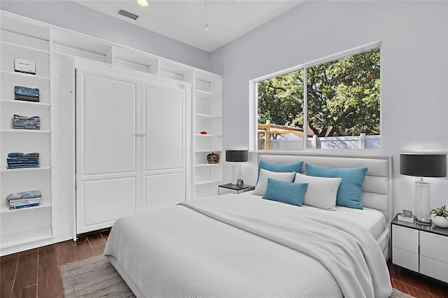 1424 Ridge Shore Dr, Tarpon Springs, FL 34689 - bedroom with dark wood-style flooring