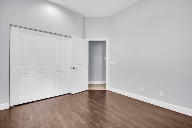 1424 Ridge Shore Dr, Tarpon Springs, FL 34689 - unfurnished bedroom with wood finished floors and a closet