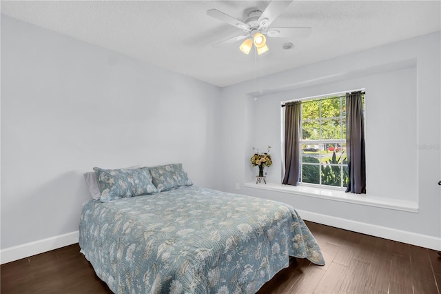 1424 Ridge Shore Dr, Tarpon Springs, FL 34689 - bedroom with wood finished floors, ceiling fan, and a textured ceiling