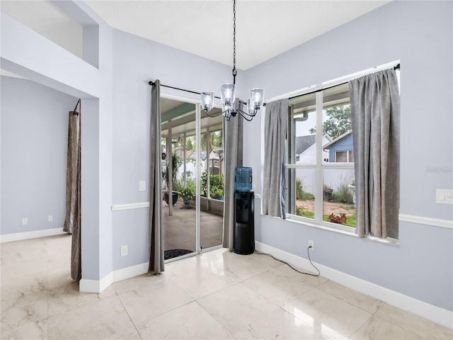 1424 Ridge Shore Dr, Tarpon Springs, FL 34689 - unfurnished dining area with a chandelier and plenty of natural light