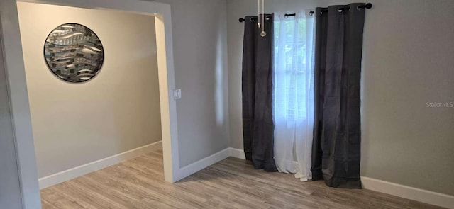 917 Adamson Ct, Lake Alfred, FL 33850 - empty room with baseboards and wood finished floors