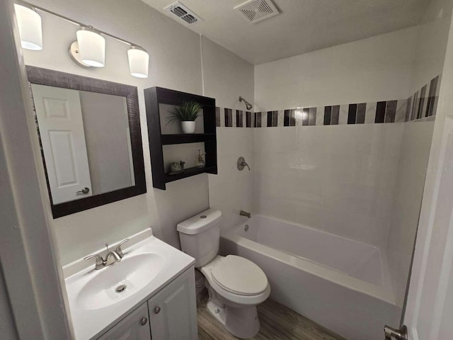 917 Adamson Ct, Lake Alfred, FL 33850 - bathroom with vanity, shower / washtub combination, and wood finished floors