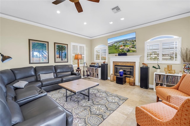 living area with crown molding, a ceiling fan, visible vents, and recessed lighting