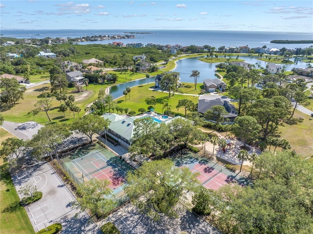 drone / aerial view with a water view and a residential view
