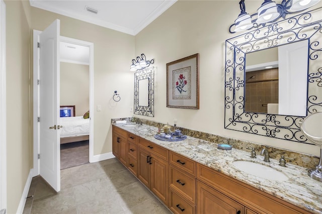 ensuite bathroom with double vanity, visible vents, ornamental molding, and a sink