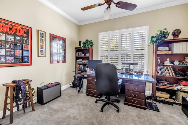 office area with crown molding, a ceiling fan, carpet, and baseboards