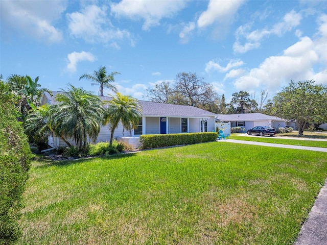single story home featuring driveway and a front yard