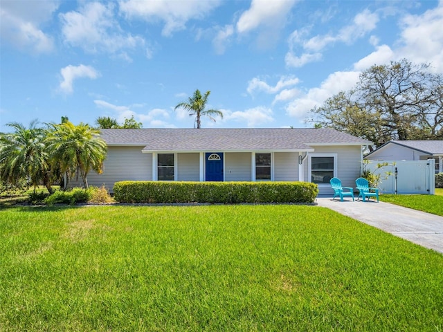 ranch-style house with a front lawn and fence