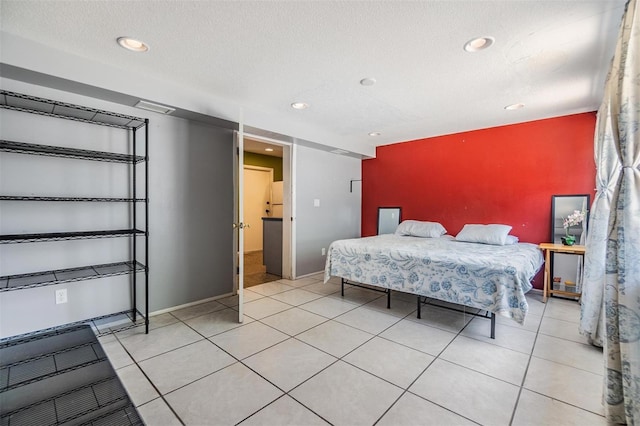 bedroom featuring recessed lighting, baseboards, and an accent wall