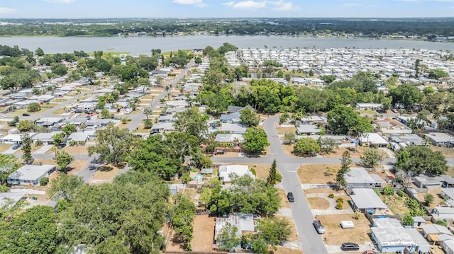 drone / aerial view with a water view and a residential view