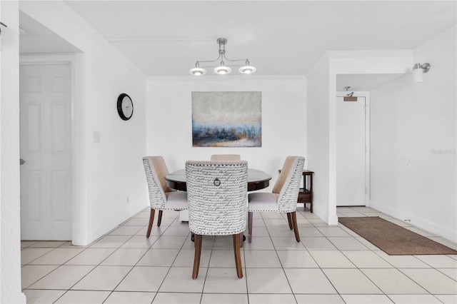 1 Key Capri Unit 303E, Treasure Island, FL 33706 - dining space with crown molding and light tile patterned flooring