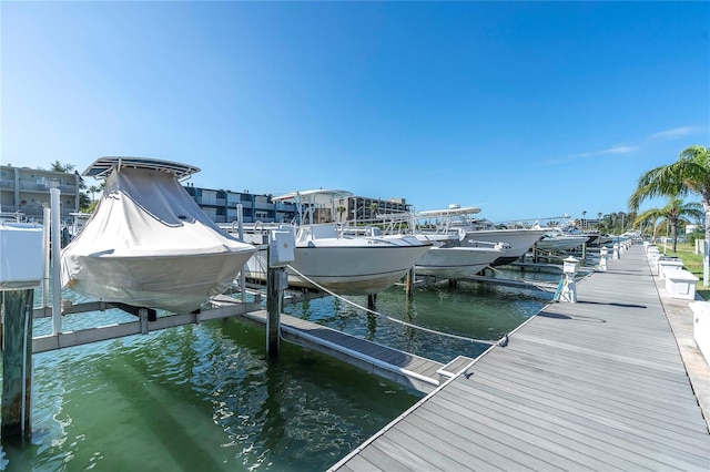 1 Key Capri Unit 303E, Treasure Island, FL 33706 - dock area with boat lift and a water view