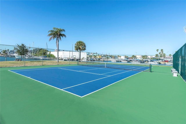 1 Key Capri Unit 303E, Treasure Island, FL 33706 - view of tennis court featuring fence
