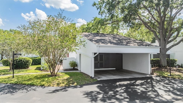 4002 Cypress Ct Unit 4002, Tampa, FL 33618 - exterior space with aphalt driveway and an attached carport